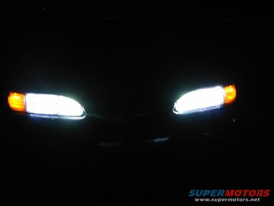 1995 Ford Thunderbird headlights and grille at night