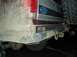 1996 Ford Bronco - Mud-caked rear bumper and tire of a 1996 Ford Bronco.
