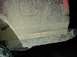 1996 Ford Bronco - The rear of a vehicle is covered in mud, obscuring its details.