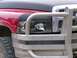 1989 Chevrolet Blazer - A close-up view of a red truck's front end, showing the headlight and part of the grille.