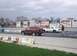 1998 Ford Crown Victoria - A drag race is about to begin with an SUV and a sedan lined up on the track.