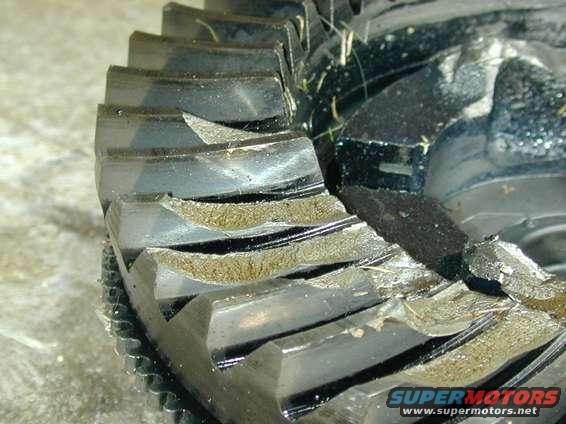Close-up of worn differential gear teeth with visible damage