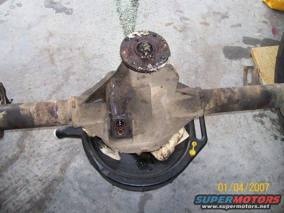 Rear axle differential assembly with a drain pan underneath. Date stamp reads 01/04/2007