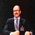 1986 Ford Bronco - A man in formal attire addresses an unseen audience.