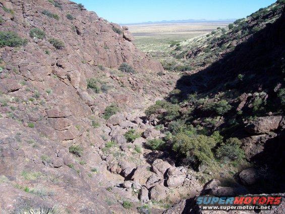 102_0708.jpg went hiking/ mtn climbing. look for the guy in the white shirt in the middle of screen and a guy in an orange shirt. that shows how high we were into the mountain. was a hell of a climb