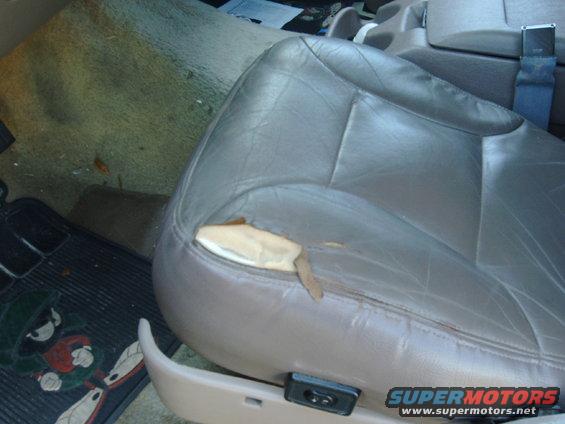 Torn brown leather driver's seat in a 1994 Ford Bronco