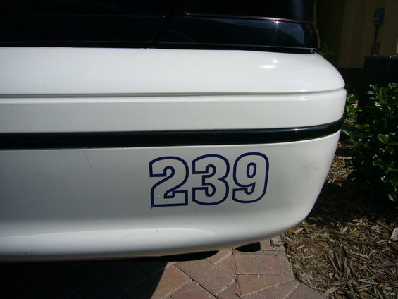 White rear bumper with blue number 239