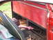 1966 Ford Ranchero - Interior view of a red pickup truck bed, showing an umbrella and a bag, with the Supermotors.net logo in the corner.