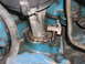 1981 Ford Bronco - Engine component detail showing a bolted bracket on a blue painted block.