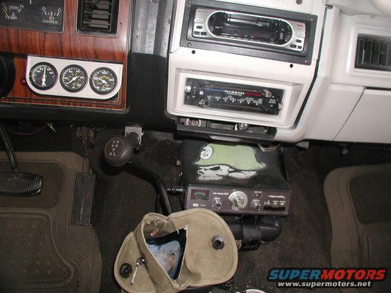 Interior dashboard with gauges, CB radio, and aftermarket stereo