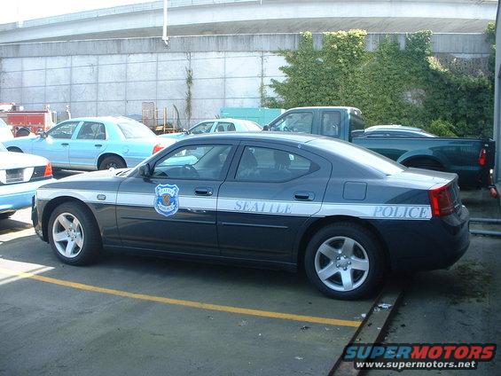 Seattle Police Dodge Charger parked next to other vehicles