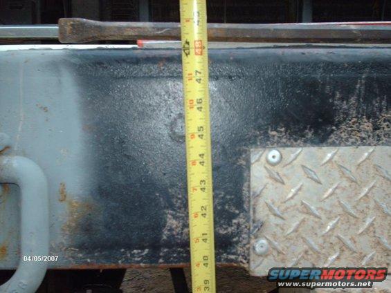 Truck frame section with a yellow measuring tape showing 40-47 inches
