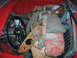 1959 MG A - The interior of a 1959 MG A is packed with various car parts, including the steering wheel and dashboard components.