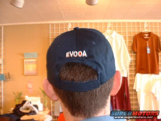Back of a navy blue baseball cap with 'EVOOA' embroidered in white and orange