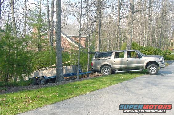 just-a-little-weekend-work2.jpg Should have took a pict when it was about 100' down the hill!  The only hard part was getting the truck over the hump and onto the grass like you see it here.
Trailer and all was about 8500# I would say
The X did a great job of gettnig it up out of there
