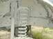 1996 Ford Bronco - The image shows the underside of a vehicle, focusing on the shock absorber and coil spring assembly.