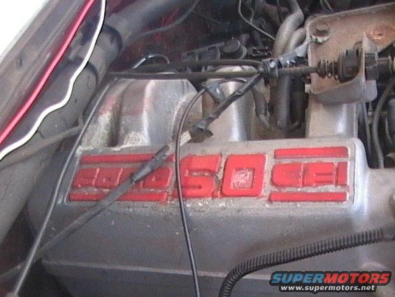 Engine intake manifold with red lettering reading "5.0 EFI"