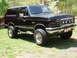 1989 Ford Bronco - This black 1989 Ford Bronco is equipped with a lift kit and auxiliary KC lights.
