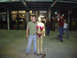 1970 Mercury Cougar - A man poses with an inflatable doll in front of a building entrance at night.