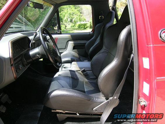 Interior of a 1991 Ford Bronco showing racing seats and dashboard