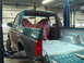 1996 Ford Bronco - The rear of a green Ford Bronco is shown with the bed area exposed and seats covered.