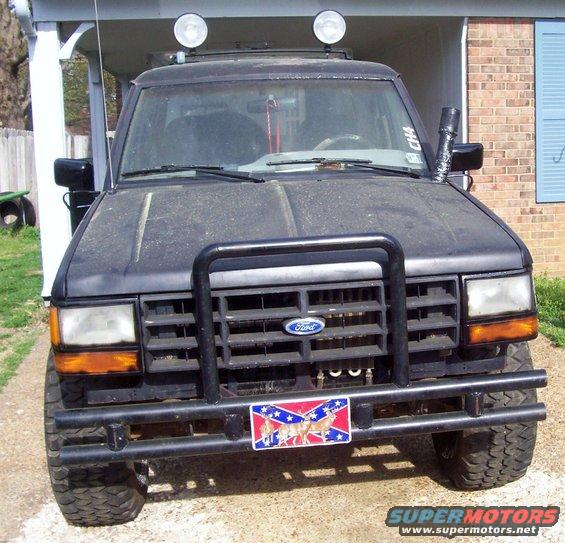 Black 1989 Ford Bronco II with a bull bar and roof-mounted lights
