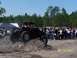 1989 Ford Bronco - A crowd watches an off-road vehicle navigate a dirt obstacle during an event on March 18, 2007.