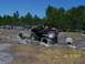 1989 Ford Bronco - An off-road vehicle tackles a challenging obstacle course with concrete pipes and dirt terrain.