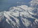 1995 Ford C-350 (Centurion Conversions) - Aerial view of , snow-covered mountain ranges stretching into the distance.