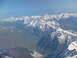 1995 Ford C-350 (Centurion Conversions) - Aerial view of snow-covered mountain ranges stretching across the horizon.