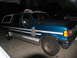1995 Ford C-350 (Centurion Conversions) - This modified Ford Bronco SUV has a custom extended body and roof rack, with visible bodywork in progress.