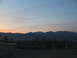 1995 Ford C-350 (Centurion Conversions) - A scenic view of mountains under a twilight sky, with a fence and road in the foreground.