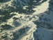 1995 Ford C-350 (Centurion Conversions) - A vast expanse of snow-covered mountains and evergreen trees under a bright sky.