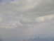 1995 Ford C-350 (Centurion Conversions) - A hazy view of a city skyline under a cloudy sky.