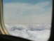 1995 Ford C-350 (Centurion Conversions) - Looking out the window at clouds from an airplane.