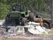 1989 Ford Bronco - Off-road vehicles navigate a challenging course of concrete obstacles during an event.