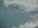1995 Ford C-350 (Centurion Conversions) - View from above shows a vast expanse of water under a cloudy sky.