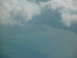 1995 Ford C-350 (Centurion Conversions) - Clouds obscure the view of the water and coastline from this aerial perspective.