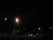 1995 Ford C-350 (Centurion Conversions) - A blurry night scene with multiple light sources, including street lamps and distant building illumination.