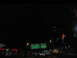 1995 Ford C-350 (Centurion Conversions) - Driving at night on a highway with illuminated signs and city lights in the distance.