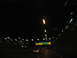 1995 Ford C-350 (Centurion Conversions) - Driving on a highway at night, with blurred lights creating streaks of color across the dark scene.