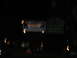 1995 Ford C-350 (Centurion Conversions) - Nighttime view of illuminated road signs and passing vehicle lights.