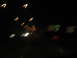 1995 Ford C-350 (Centurion Conversions) - Blurry lights streak across the dark frame, suggesting motion on a road at night.