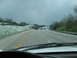 1995 Ford C-350 (Centurion Conversions) - Driving on a highway with multiple vehicles visible under a cloudy sky.