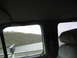 1995 Ford C-350 (Centurion Conversions) - Looking out the window from the passenger seat of a vehicle.