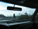 1995 Ford C-350 (Centurion Conversions) - View from inside a vehicle on a road trip, looking out the windshield at the passing scenery.