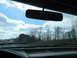 1995 Ford C-350 (Centurion Conversions) - Driving on the highway under a cloudy sky, passing a road sign.