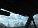 1995 Ford C-350 (Centurion Conversions) - View from inside the vehicle shows the sky and trees through the windshield.
