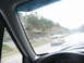 1995 Ford C-350 (Centurion Conversions) - Driving on the highway behind a gold minivan with other vehicles ahead.