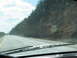 1995 Ford C-350 (Centurion Conversions) - View from inside a vehicle on a highway, with a windshield wiper visible.